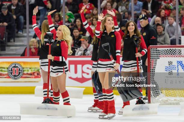 Chicago Blackhawks Ice Crew members clean the ice in the 1st period during an NHL hockey game between the Colorado Avalanche and the Chicago...