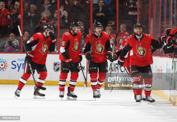 Marian Gaborik of the Ottawa Senators celebrates his second period goal against the Florida Panthers with teammates at the players bench including...
