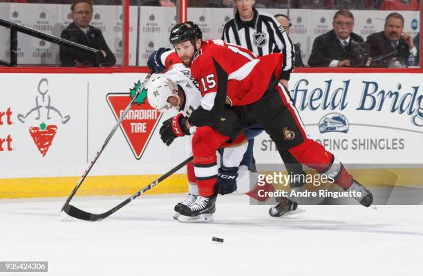 Zack Smith of the Ottawa Senators battles for puck possession against Jonathan Huberdeau of the Florida Panthers at Canadian Tire Centre on March 20,...