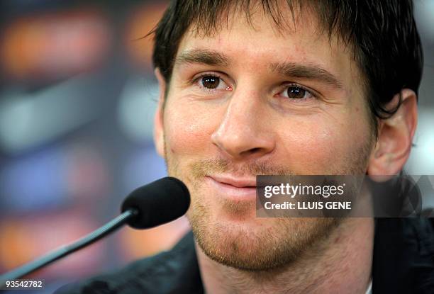 Barcelona's Argentinian forward Lionel Messi smiles during a press conference at the Ciutat esportiva Joan Gamper near Barcelona on December 1, 2009....