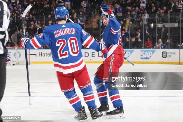 Mika Zibanejad and Chris Kreider of the New York Rangers celebrate after scoring a goal in the third period against the Columbus Blue Jackets at...