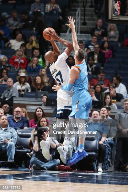 Taj Gibson of the Minnesota Timberwolves shoots the ball against Sam Dekker of the LA Clippers during the game between the two teams on March 20,...