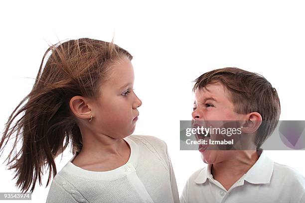 little brother screaming at her older sister. - conflict of interest stock pictures, royalty-free photos & images