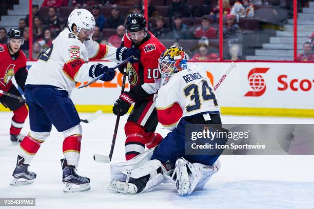 Florida Panthers Goalie James Reimer loses the puck after trying to make an awkward save with Florida Panthers Winger Denis Malgin and Ottawa...