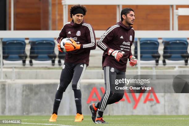 Guillermo Ochoa and Jesus Corona goalkeepers of Mexico warm up during the Mexico National Team training session at Avaya Stadium on March 20, 2018 in...