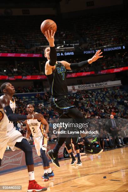 Dwight Powell of the Dallas Mavericks handles the ball against the New Orleans Pelicans on March 20, 2018 at the Smoothie King Center in New Orleans,...