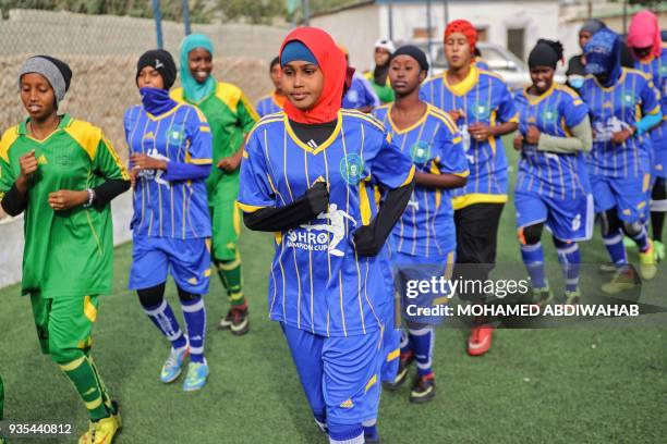 Somali football players of Golden Girls Football Centre, Somalia's first female soccer club, attend their training session at Toyo stadium in...