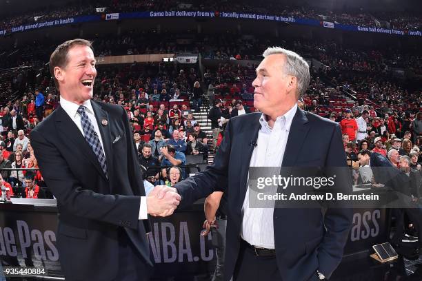 Head Coach Mike D'Antoni of the Houston Rockets and Head Coach Terry Stotts of the Portland Trail Blazers greet each other before the game between...