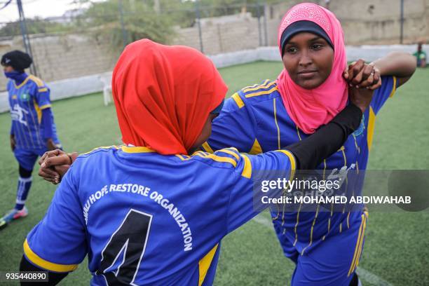 Somali football players of Golden Girls Football Centre, Somalia's first female soccer club, attend their training session at Toyo stadium in...