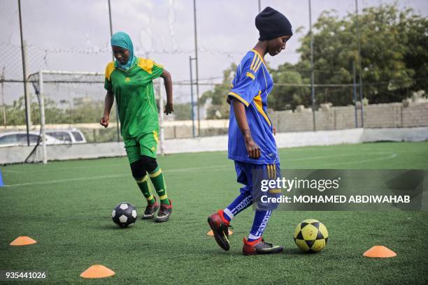 Somali football players of Golden Girls Football Centre, Somalia's first female soccer club, attend their training session at Toyo stadium in...