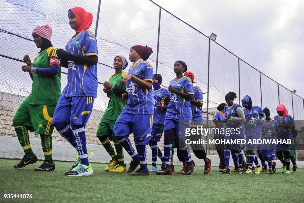 Somali football players of Golden Girls Football Centre, Somalia's first female soccer club, attend their training session at Toyo stadium in...