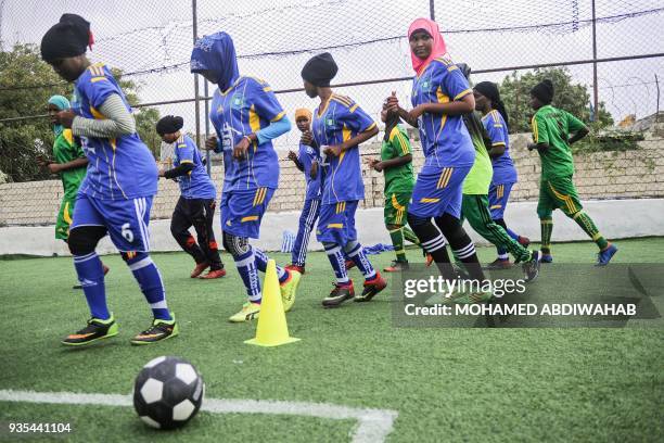 Somali football players of Golden Girls Football Centre, Somalia's first female soccer club, attend their training session at Toyo stadium in...