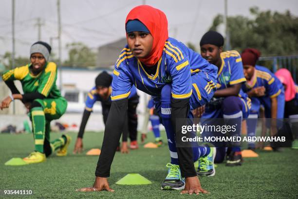 Somali football players of Golden Girls Football Centre, Somalia's first female soccer club, attend their training session at Toyo stadium in...