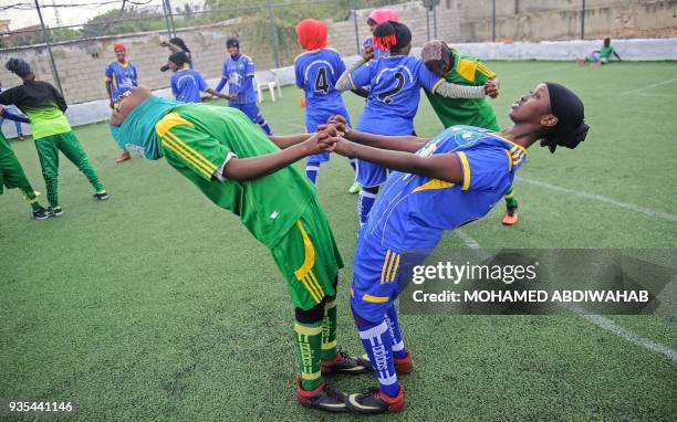 Somali football players of Golden Girls Football Centre, Somalia's first female soccer club, attend their training session at Toyo stadium in...