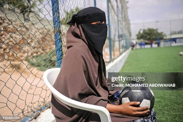 Aisha Alli a Somali football player of Golden Girls Football Centre, Somalia's first female soccer club, watches a match during a training session at...