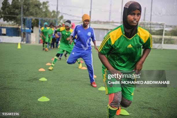 Somali football players of Golden Girls Football Centre, Somalia's first female soccer club, attend their training session at Toyo stadium in...