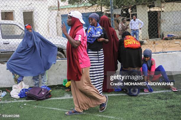 Somali football players of Golden Girls Football Centre, Somalia's first female soccer club, prepare for their training session at Toyo stadium in...