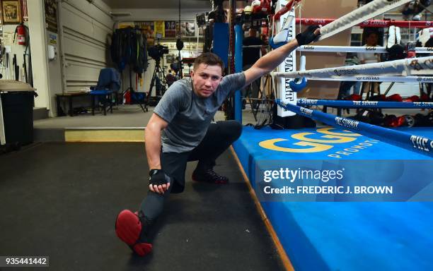 Boxer Gennady Golovkin stretches ringside during a media workout on March 20, 2018 in Big Bear, California, ahead of his fight against Canelo Alvarez...