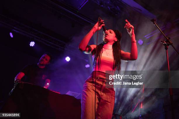 Electronic musician George FitzGerald and a singer of his live band perform live on stage during a concert at Schwuz on March 20, 2018 in Berlin,...