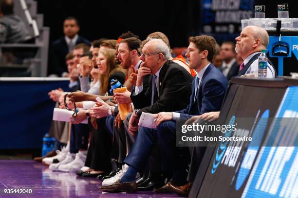Syracuse Orange head coach Jim Boeheim, center, watches the action on the court with his coaching staff during the NCAA Division I Men's Championship...