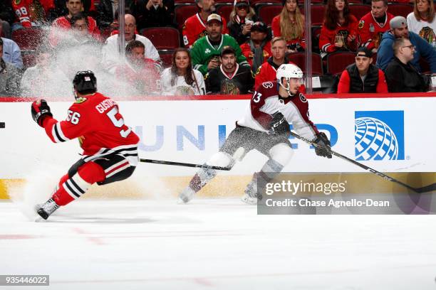 Matt Nieto of the Colorado Avalanche skates past Erik Gustafsson of the Chicago Blackhawks in the third period at the United Center on March 20, 2018...