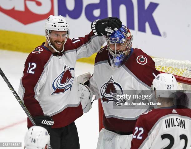 Patrik Nemeth, Semyon Varlamov and Colin Wilson of the Colorado Avalanche celebrate a win over the Chicago Blackhawks at the United Center on March...