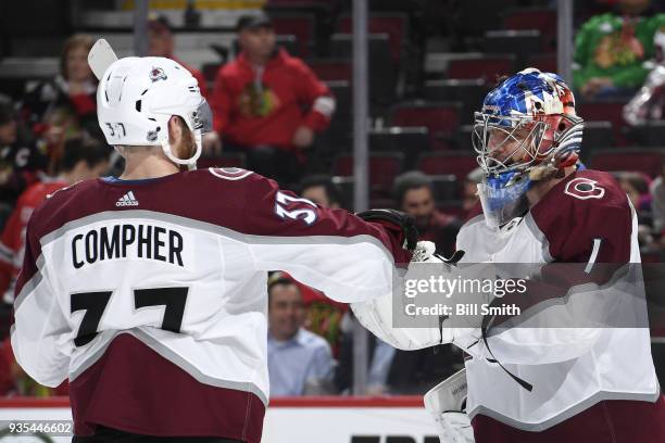 Compher and goalie Semyon Varlamov of the Colorado Avalanche celebrate after defeating the Chicago Blackhawks 5-1 at the United Center on March 20,...