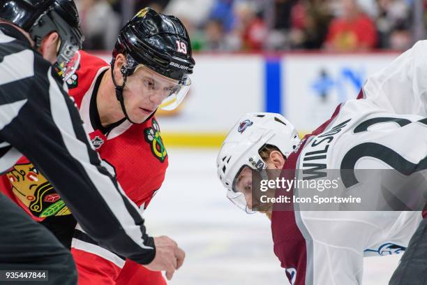 Chicago Blackhawks center Jonathan Toews and Colorado Avalanche center Colin Wilson face-off in the 3rd period during an NHL hockey game between the...