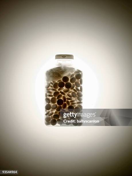 medicine bottle filled with pills. - full transparency stock pictures, royalty-free photos & images