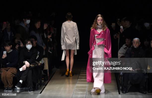 Model presents a creation by Japanese designer Keisuke Yoshida for his 2018 autumn/winter collection at Tokyo Fashion Week in Tokyo on March 21,...