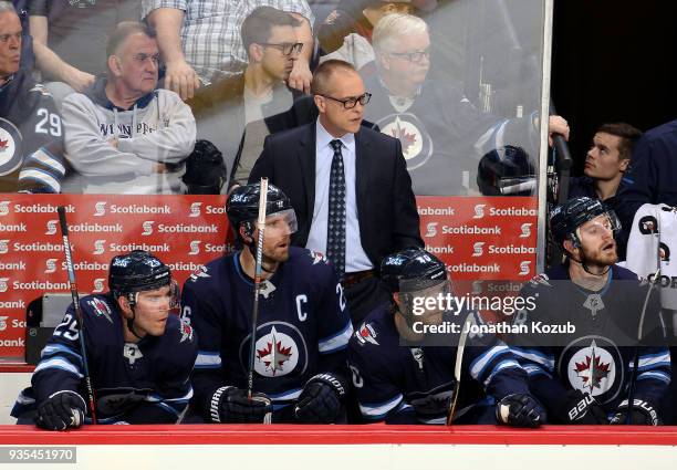 Head Coach Paul Maurice, Paul Stastny, Blake Wheeler, Joel Armia and Bryan Little of the Winnipeg Jets look on during third period action against the...