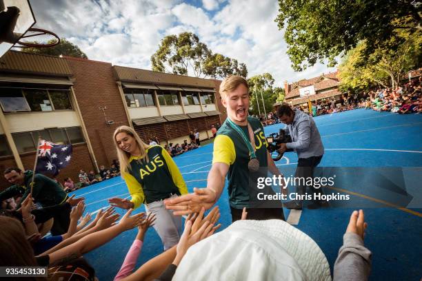 Australian Winter Olympic athletes Jarryd Hughes and Emily Anthony are seen with students at Fitzroy North Primary School on March 21, 2018 in...