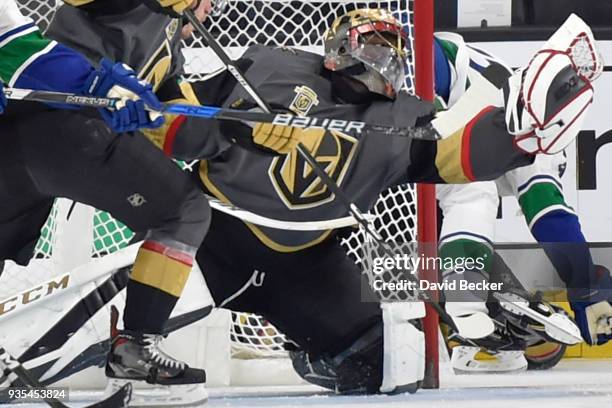 Malcolm Subban of the Vegas Golden Knights makes a save against the Vancouver Canucks during the game at T-Mobile Arena on March 20, 2018 in Las...