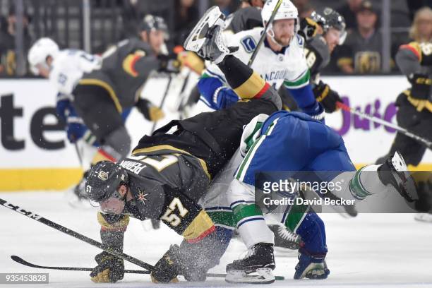 David Perron of the Vegas Golden Knights collides with Brendan Leipsic of the Vancouver Canucks during the game at T-Mobile Arena on March 20, 2018...