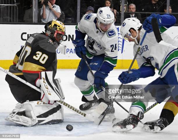 Malcolm Subban of the Vegas Golden Knights blocks a shot by Nic Dowd of the Vancouver Canucks as Reid Boucher of the Canucks looks for a rebound in...