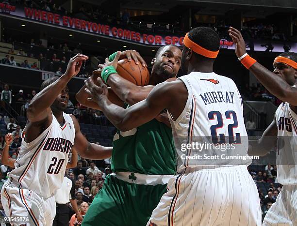 Shelden Williams of the Boston Celtics grabs a rebound against Flip Murray of the Charlotte Bobcats on December 1, 2009 at the Time Warner Cable...