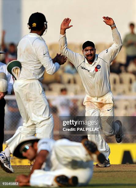 Indian cricketer Harbhajan singh celebrates after taking the wicket of Sri Lankan batsman Rangana Herath on the first day of the third cricket Test...