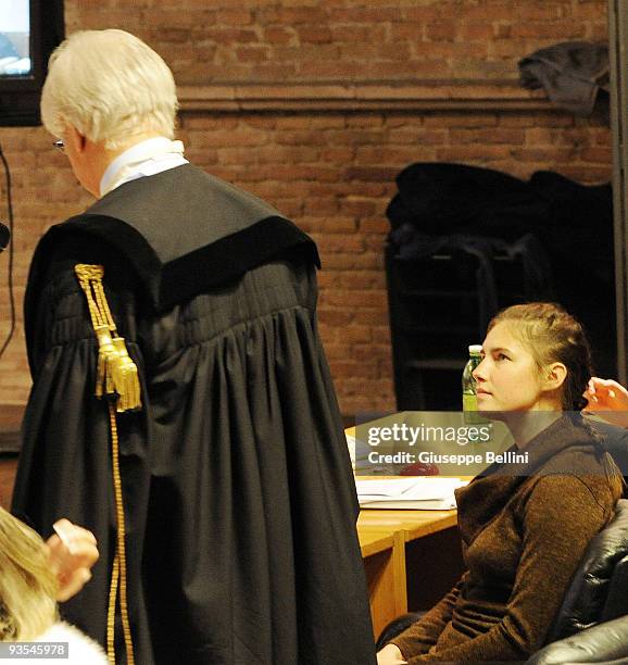 Amanda Knox and her lawyer Luciano Ghirga attend the Meredith Kercher Trial for the closing arguments at the courthouse on December 2, 2009 in...