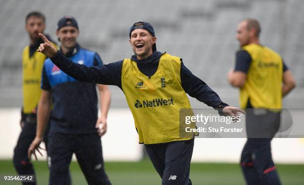 England captain Joe Root reacts during a game of Football in the rain during England nets ahead of the 1st Test Match against the New Zealand Black...