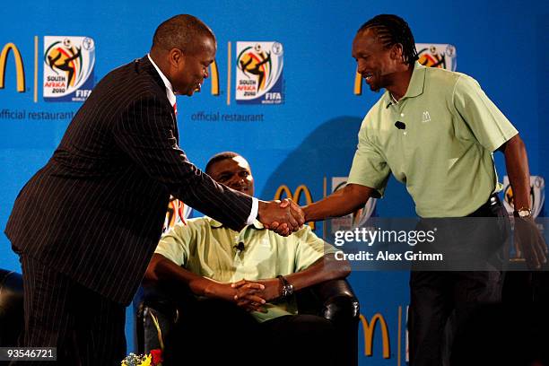 Host Robert Marawa welcomes former football stars Marcel Desailly and John Moshoeu during a press conference of official 2010 FIFA World Cup sponsor...