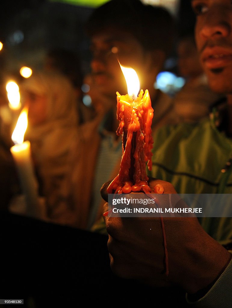 Candle wax drips over the hand of a 1984