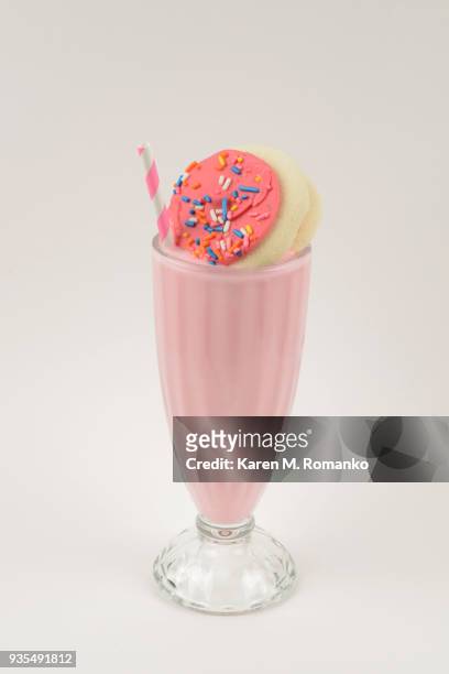 strawberry flavored milkshake - white background - strawberry milkshake and nobody stock pictures, royalty-free photos & images