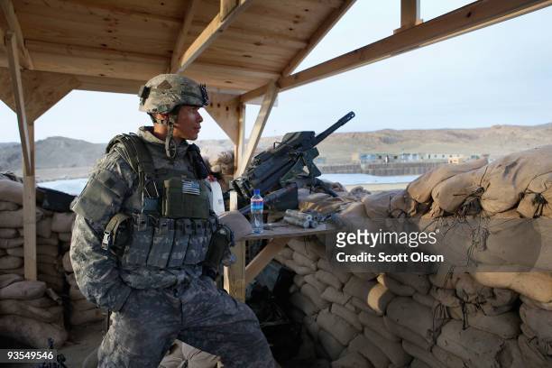 Kenneth Nall from Lubbock, TX of the Army's Blackfoot Company 1st Battalion 501st Parachute Infantry Regiment keep watch over the Afghan National...