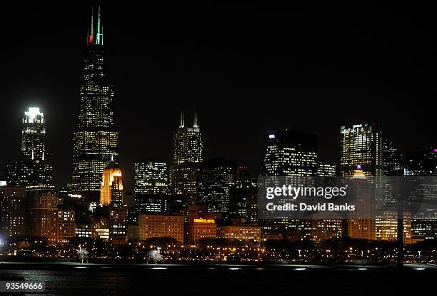 Chicago's CNA Building is illuminated in honor of World AIDS Day. Chicago is one of ten major cities joining to raise awareness and funds to help...