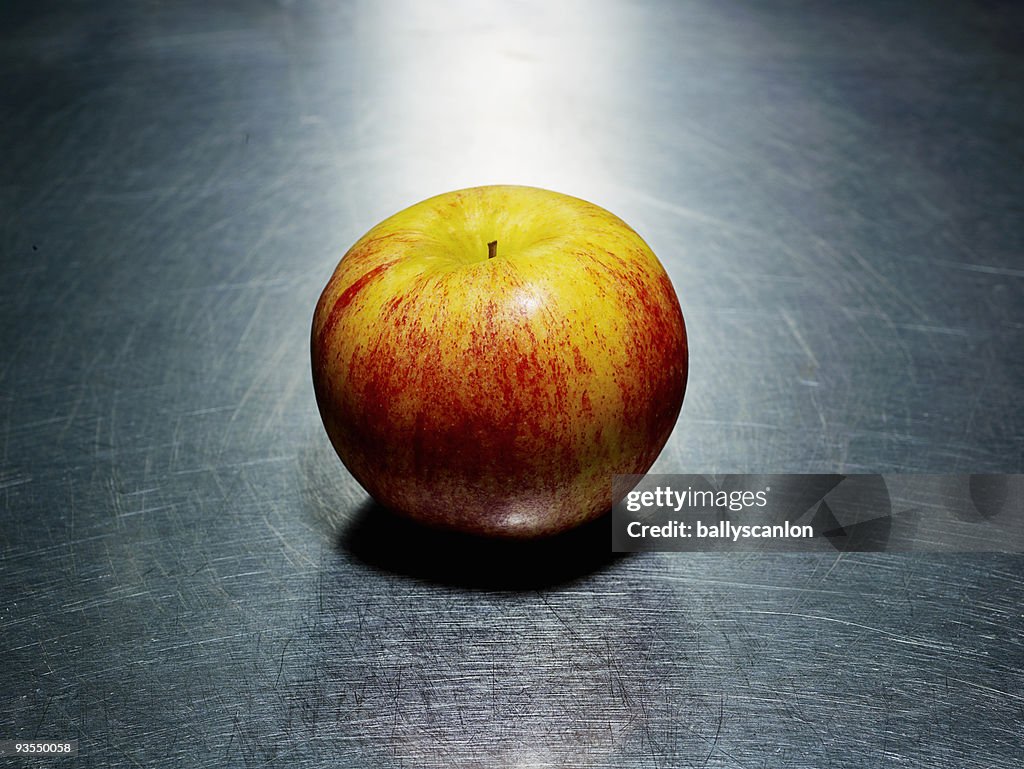 Apple on Stainless Steel Background.