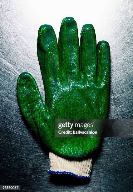 green protective glove. - green glove 個照片及圖片檔