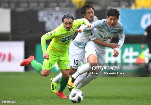 Takayuki Funayama of JEF United Chiba , Park Chan Yong and Kazumasa Takagi of Kamatamare Sanuki compete for the ball during the J.League J2 match...