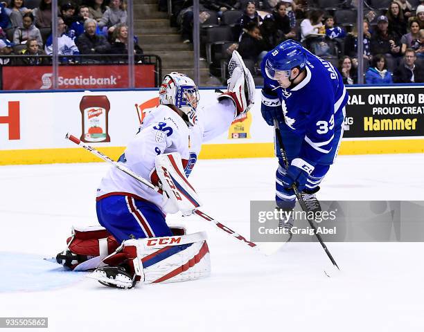 Frederick Gauthier of the Toronto Marlies jumps in front of goalie Zachary Fucale of the Laval Rocket during AHL game action on March 12, 2018 at Air...