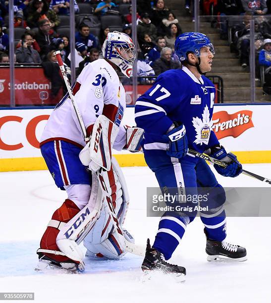 Richard Clune of the Toronto Marlies puts a screen on goalie Zachary Fucale of the Laval Rocket during AHL game action on March 12, 2018 at Air...