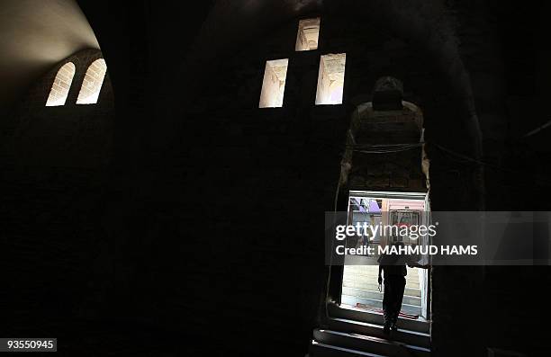 Palestinian man leaves Al-Omari mosque in Gaza City after praying on the first day of the Muslim fasting month of Ramadan on August 22, 2009. Muslims...